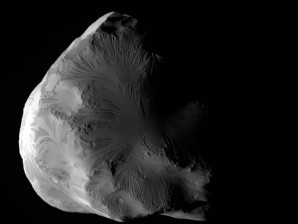 An image released by NASA is a black and white image of Saturn's moon Helene made by NASA's Cassini spacecraft on June 18, 2011. At closest approach, on June 18, Cassini flew within 4,330 miles (6,968 kilometers) of Helene's surface. Cassini passed from Helene's night side to the moon's sunlit side. AP Photo/NASA/JPL-Caltech/Space Science Institute