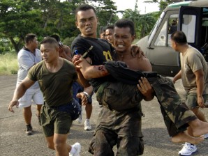 Soldiers Carry `Lucky' Wounded