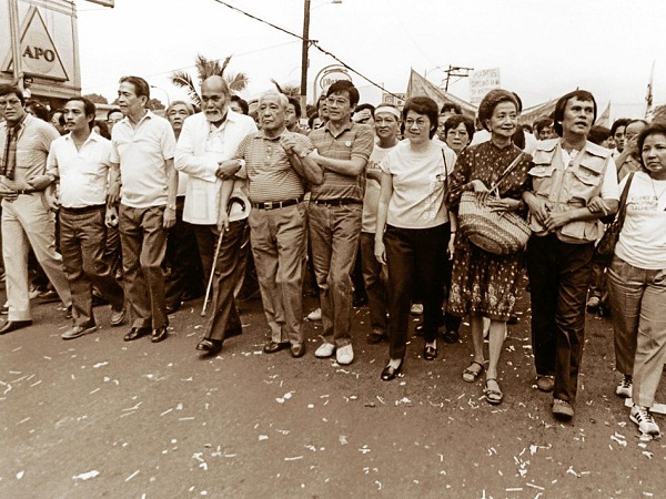 A PAGE FROM MARTIAL LAW HISTORY. The dictatorship was practically on its last legs when the usual suspects in the Marcos opposition led yet another protest march on Oct. 7, 1984. In a little over a year, People Power on Edsa would stun the world. From right: Etta Rosales, Lily de las Alas-Padilla, Cory Aquino, Wigberto Tañada, Lorenzo Tañada, Ramon Pedrosa, Ambrosio Padilla and—can you please name these two unidentified braves at the extreme left. They marched from Santo Domingo Church on Quezon Blvd Extension in Quezon City to Welcome Rotonda, on the boundary with Manila, where a reception party of riot cops dispersed them. INQUIRER PHOTO