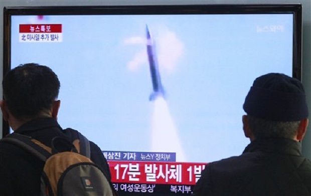 People watch TV reporting North Korea's missile test at Seoul Railway Station in Seoul, South Korea, Tuesday, March 4, 2014. AP