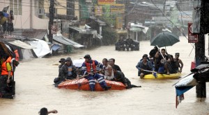 Trapped residents are rescued to safety after heavy monsoon rains spawned by tropical storm Fung-Wong flooded Marikina city, east of Manila, Philippines, and most parts of the metropolis Friday, Sept 19, 2014 AP
