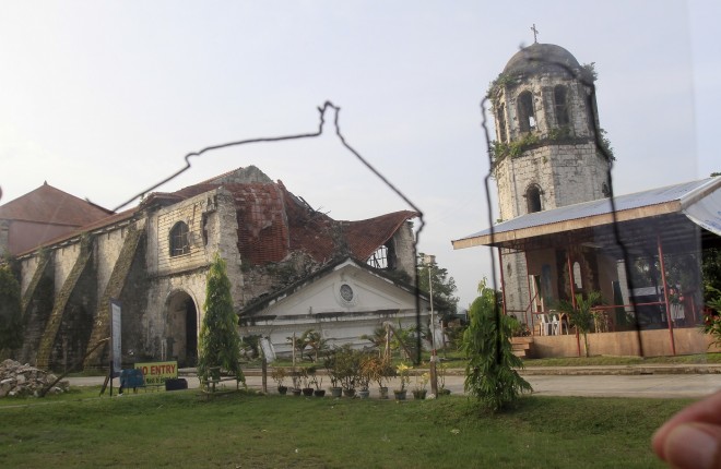 October 13, 2014 Loay church after  being heavily damaged by the October 15 earthquake that occured in the province 1 year ago.  -- On October 15, 2013 at 8:12 am a 7.5 earthquake shook through the Bohol and Cebu province killing 222 people and leaving thousands of infrastructure damaged beyond repair. It was the deadliest earthquake in the Philippines in 23 years. Centuries old churches, some built since 1602 by Jesuit missionaries succumbed to the force of the earthquake and were destroyed beyond recognition. From the Church of San Pedro Apostol in Loboc, Church of Our Lady of Light in Loon, Santissima Trinidad Parish in Loay, Our Lady of Immaculate Conception in Baclayon, Our Lady of Assumption Church in Dauis, St. Isidore the Farmer Church in tubigon and Santa Cruz Church in Maribojoc.  An outline on acetate showing the former structures of the churches were overlapped with new photographs taken a year after the devastation is shown here, a before and after look , of the iconic churches that once symbolised the soul of the community, and now evidence of nature's true power. INQUIRER/ MARIANNE BERMUDEZ