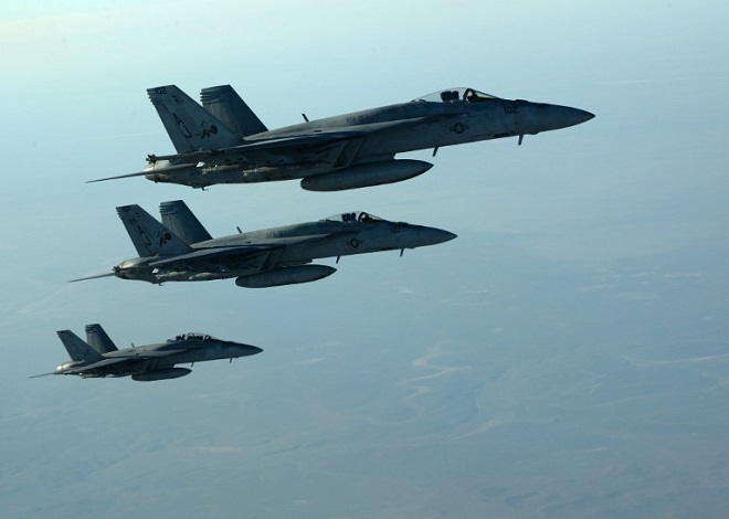 This US Air Forces Central Command photo released by the Defense Video & Imagery Distribution System (DVIDS) shows a formation of US Navy F-18E Super Hornets in flight after receiving fuel from a KC-135 Stratotanker over northern Iraq, on September 23, 2014. These aircraft were part of a large coalition strike package that was the first to strike ISIL targets in Syria.    AFP PHOTO / US Air Force / Staff Sgt. Shawn Nickel    == RESTRICTED TO EDITORIAL  USE / MANDATORY CREDIT:  "AFP PHOTO / US Air Forces Central Command via DVIDS /  Staff Sgt. Shawn Nickel" /  NO SALES / NO MARKETING / NO ADVERTISING CAMPAIGNS / DISTRIBUTED AS A SERVICE TO CLIENTS ==
