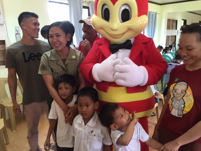 Residents of Pag-asa were treated to Jollibee meals and to the presence of its mascot, a first on the island.