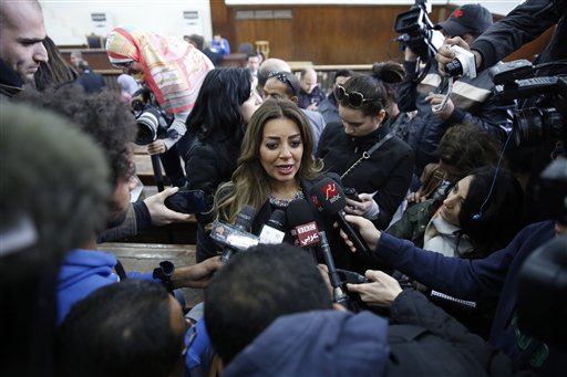 Marwa Omara, the fiancee of Al-Jazeera English journalist Mohammed Fahmy, talks to journalists in a courthouse near Tora prison in Cairo, Egypt, Thursday, Feb. 12, 2015. An Egyptian judge ordered Fahmy and another Al-Jazeera English journalist, Baher Mohammed, released on bail Thursday as their retrial on terror-related charges continues. (AP Photo/Hassan Ammar)