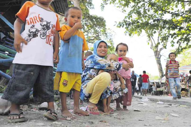 WOMEN and children displaced by a military campaign against the Bangsamoro Islamic Freedom Fighters have sought shelter at a public elementary school in Datu Saudi Ampatuan in Maguindanao province. The number of evacuees has reportedly reached over 123,000.JEOFFREY MAITEM/INQUIRER MINDANAO FILE PHOTO