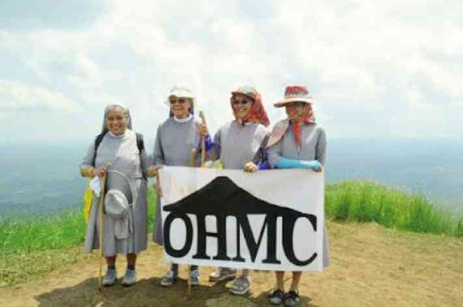 CLIMBING NUNS This photo may remind people of the classic film “The Sound of Music,” but St. Paul of Chartres nuns (from left) Anna Maria Reyes, Aurelie Cortez, Arcelita Sarnillo and Rachelle Rapio did climb the 630-meter Mount Talamitam in Nasugbu, Batangas province, in sneakers to raise funds for the sick and the poor. ONE HIKE MOUNTAINEERING CLUB/CONTRIBUTOR
