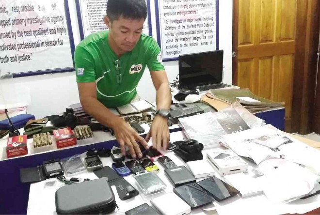 POLICE confiscated two handguns and various paraphernalia from Maria Concepcion Araneta-Bocala, who was arrested on Saturday. NESTOR P. BURGOS  JR./INQUIRER VISAYAS
