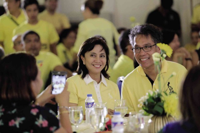 WOOING LENI  Camarines Sur Rep. Leni Robredo and Liberal Party standard-bearer Mar Roxas take time off to discuss political plans during the oath-taking of new members of the ruling LP in Naga City on Friday when  Roxas formally declared his intention to have the widow of the late Interior Secretary Jesse Robredo to be his running mate. But despite heightened pressure from the party, she has yet to make a decision.           MARK ALVIC ESPLANA/INQUIRER SOUTHERN LUZON 