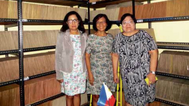 STAGGERING JOB Tens of thousands of case files line the walls of the offices of the Human Rights Victims Claims Board awaiting resolution, amonumental job for board chief Lina Sarmiento and members Aurora Parong and Erlinda Senturias. MA. CERES P. DOYO