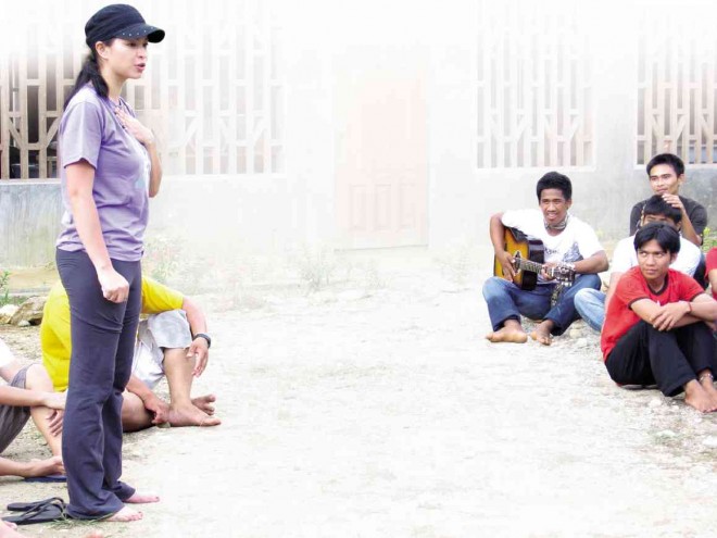 BAREFOOT actress Angel Locsin shares her experience at the Alcadev school during a visit in 2009 as then third year student Rico Pareja (in red shirt) listens. PHOTO COURTESY OF ALCADEV