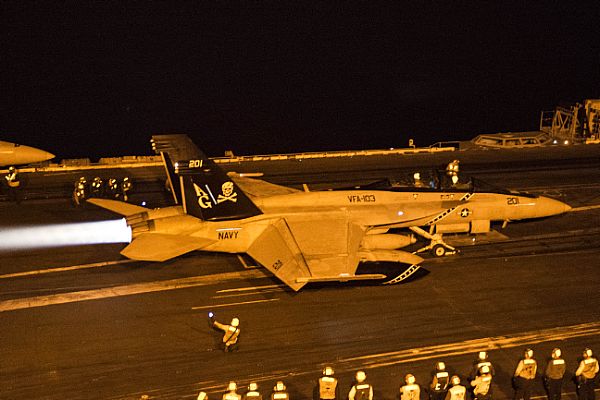 151228-N-DZ642-012  ARABIAN GULF (Dec. 28, 2015) An F/A-18F Super Hornet, assigned to the “Jolly Rogers” of Strike Fighter Squadron (VFA) 103, launches from the flight deck of the aircraft carrier USS Harry S. Truman (CVN 75). The Harry S. Truman Carrier Strike Group is deployed in support of maritime security operations and theater security cooperation efforts in the U.S. 5th Fleet area of responsibility. (U.S. Navy photo by Mass Communication Specialist 3rd Class B. Siens/Released)