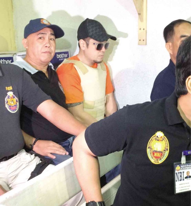  Sandy de Guzman during his arraignment Thursday in a Quezon City court, where he refused to enter  a plea. Erika Sauler 
