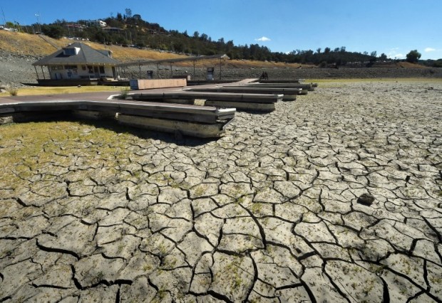 This file photo taken on September 17, 2015 shows boat docks sitting empty on dry land in Folsom Lake reservoir near Sacramento during the severe drought in California last year.  A report by the US National Oceanic and Atmospheric Administration (NOOA) on January 20, 2016 say that 2015 was the planet's hottest year in modern times setting a troubling new milestone as the climate warms at an increasing pace. AFP FILE PHOTO