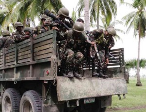 Soldiers prepare to jump from an Army truck during operations. INQUIRER FILE PHOTO