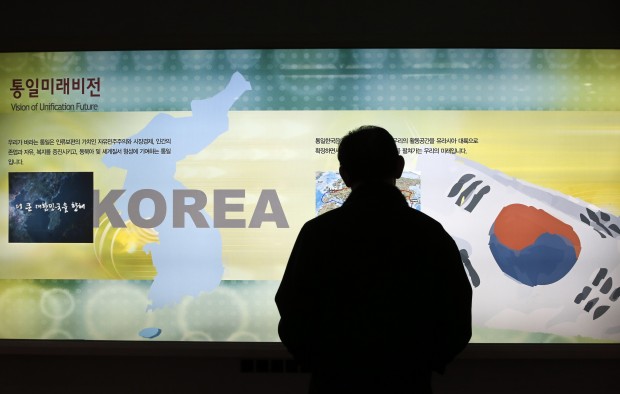 A visitor looks at a map of the Korean peninsula at the exhibition hall of the unification observatory in Paju, South Korea, Wednesday, Feb. 10, 2016. South Korea says it will suspend the operations at a joint industrial park with North Korea in response to the North's recent rocket launch. (AP Photo/Lee Jin-man)