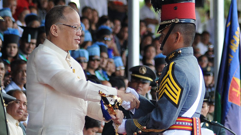 PMA VALEDICTORIAN   President Aquino presents the Presidential Saber to newly commissioned Ensign Kristian Daeve Abiqui, valedictorian of Philippine Military Academy Class of 2016, during commencement exercises at Fort Del Pilar, Baguio City, on Sunday. EV ESPIRITU/INQUIRER NORTHERN LUZON