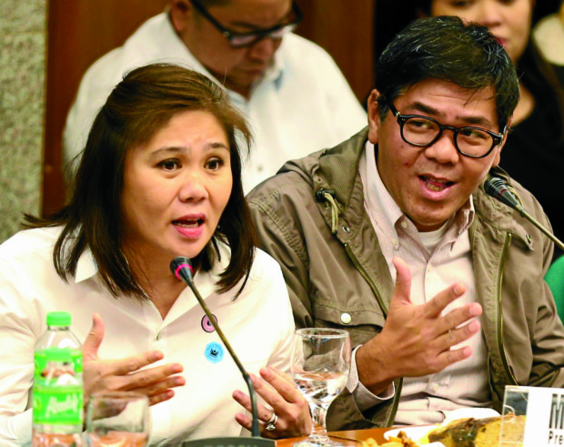 Salud Bautista and Michael Bautista of Philrem Service Corporation at the Senate Blue Ribbon Committee inquiry into the laundering of $81 million stolen from Bangladesh Bank which was deposited into bank accounts in RCBC's Jupiter branch in Makati City. At right is businessman William So Go. INQUIRER FILE PHOTO/LYN RILLON