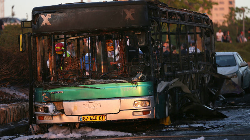 A burned bus is seen in Jerusalem, Monday, April 18, 2016. A bus exploded in the heart of Jerusalem Monday, wounding at least 15 people who appeared to have been in an adjacent bus that was also damaged. The explosion raised fears of a return to the Palestinian suicide attacks that ravaged Israeli cities a decade ago. (AP Photo/Oded Balilty)