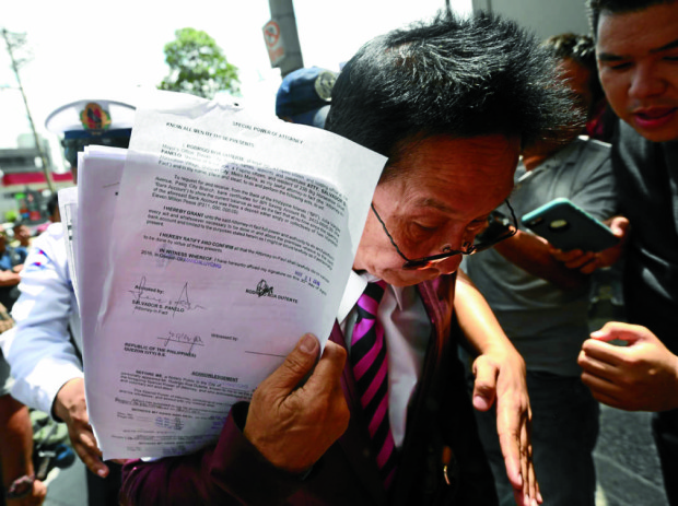 Davao City  Mayor Rodrigo Duterte's counsel Atty. Sal Panelo shows a notarized special power of attorney authorizing him to ask for a bank certificate from Bank of the Philippine Islands, after Sen. Antonio Trillianes alleged that Duterte had P211 million pesos in undeclared funds.  MARIANNE BERMUDEZ