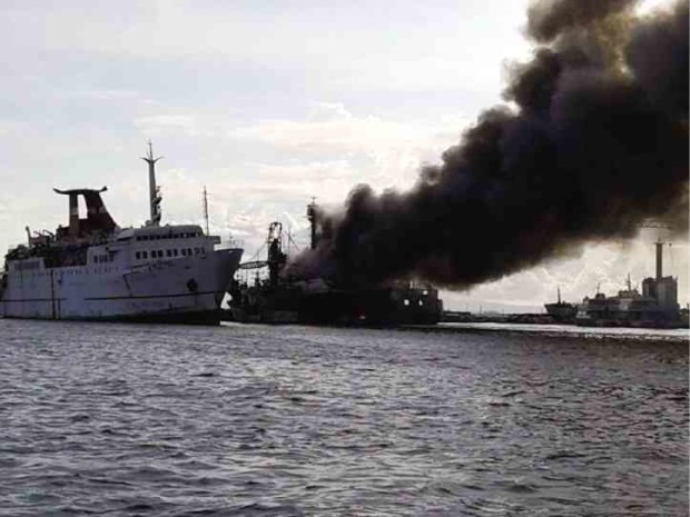 THE “Tobias Reynald Tiangco” goes up in smoke at the Navotas fish port on Monday.  BUREAU OF FIRE PROTECTION-NAVOTAS CITY 