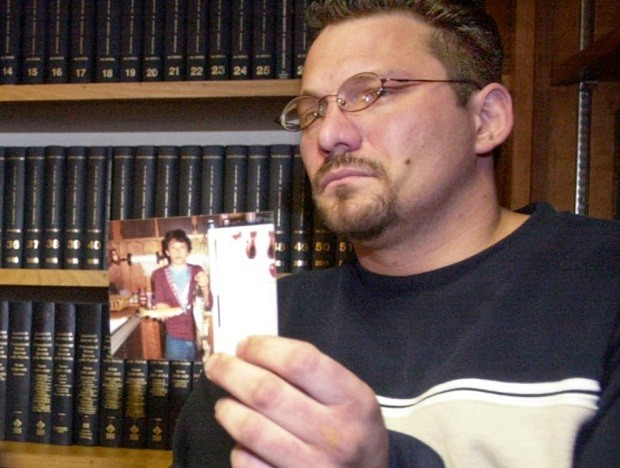 FILE – In this Feb. 6, 2003, file photo, Brian Gergely holds up an old photograph of himself while discussing a lawsuit against a priest and the Roman Catholic Diocese of Altoona-Johnstown, during a news conference in Altoona, Pa. Gergely, whose lawsuit was settled out of court in 2005, was found hanged Friday, July 1, 2016, at his home in Ebensburg, Pa., at the age of 46. (AP Photo/Keith Srakocic, File)