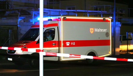 An ambulance stands at a road block in Wuerzburg, southern Germany, Monday evening July 18, 2016. A man attacked people in a train and injured several of them. AP