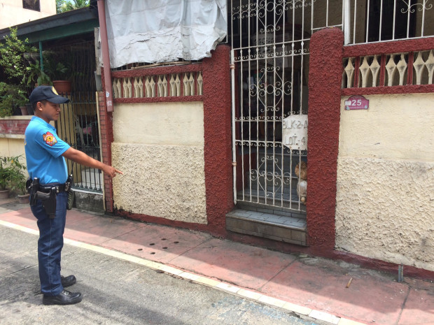 PO1 Cambe shows where the Ateneo high school teacher was shot dead in Marikina City on Monday evening. JODEE AGONCILLO/INQUIRER PHOTO