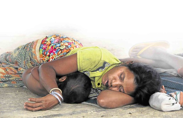 A MEMBER of the Tigwahanon tribe sleeps on the floor in a shelter in Malaybalay City where several tribespeople fled after an attack on July 30.JAJA NECOSIA/CONTRIBUTOR