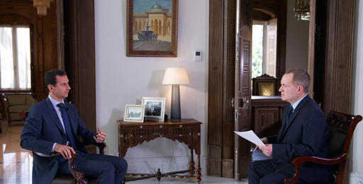 In this Wednesday, Sept. 21, 2016 photo released by the Syrian Presidency, Syrian President Bashar Assad, left, speaks to Ian Phillips, Vice President, International News for The Associated Press, at the presidential palace in Damascus. Assad said U.S. airstrikes on Syrian troops in the country’s east were “definitely intentional,” lasting for an hour, and blamed the U.S. for the collapse of a cease-fire deal brokered with Russia. In the interview with the AP, Assad said the war, now in its sixth year, is likely to “drag on” because of what he said was continued external support for his opponents. (Syrian Presidency via AP)