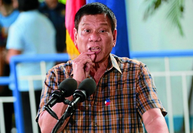 President Rodrigo Duterte, shown making a gesture in this file photo, threatens to literally eat members of the Abu Sayyaf alive if they pursue terrorism.  INQUIRER FILE