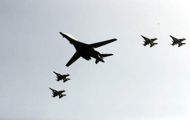 U.S. B-1 bomber, center, flies over Osan Air Base with South Korean jets in Pyeongtaek, South Korea, Tuesday, Sept. 13, 2016. The United States has flown nuclear-capable supersonic bombers over ally South Korea in a show of force meant to cow North Korea after its fifth nuclear test and also to settle rattled nerves in the South. AP