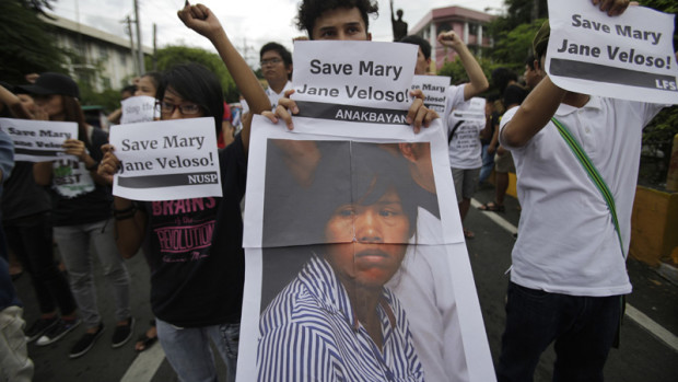 Student protesters hold a picture of Mary Jane Veloso, a Filipino convicted drug trafficker in Indonesia, as they urge Philippine President Rodrigo Duterte to save her from execution during a rally near the Malacanang presidential palace in Manila, Philippines on Tuesday, Sept. 13, 2016. Duterte visited Indonesia last week where he discussed the fate of Veloso with his Indonesian counterpart Joko Widodo. (AP Photo/Aaron Favila)