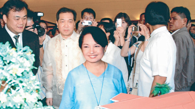 CASINO PROJECT Macau-based gambling tycoon Jack Lam (left), shown in this 2006 photowith then President Gloria Macapagal-Arroyo as he presented a scalemodel of his P2.5-billion Fontana Leisure Parks project, has reportedly left the country forHong Kong. —INQUIRER PHOTO