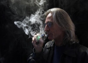 John Hartigan smokes an e-cigarette