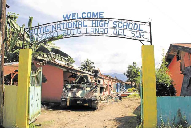An Army tank enters a school in Butig, Lanao del Sur, that had been occupied by members of the Maute group. —RICHEL V. UMEL
