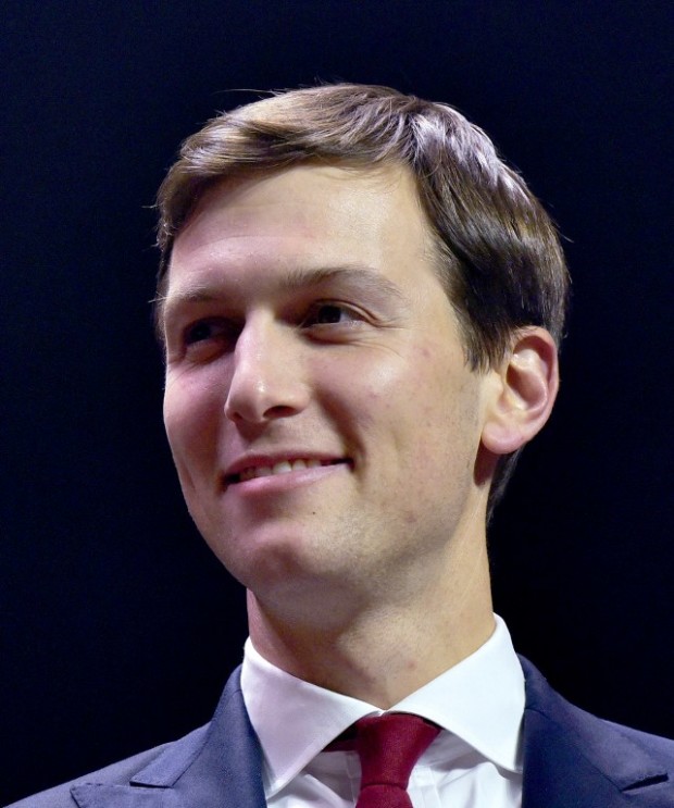 (FILES) This November 7, 2016 file photo shows Jared Kushner, husband of Ivanka Trump, watching as Republican presidential nominee Donald Trump speaks at rally on the final night of the 2016 US presidential campaign at the SNHU Arena in Manchester, New Hampshire. Newly announced White House senior advisor to the president, Jared Kushner who turned 36 years-old on January 10, 2017 is now one of the most powerful men of the United States being propelled by his father-in-law President-elect Donald Trump. Kushner will resign from his company, divest "substantial assets," and recuse himself from matters that would impact his financial interests, Gorelick said. His remaining assets will be purchased by a trust. / AFP PHOTO / MANDEL NGAN