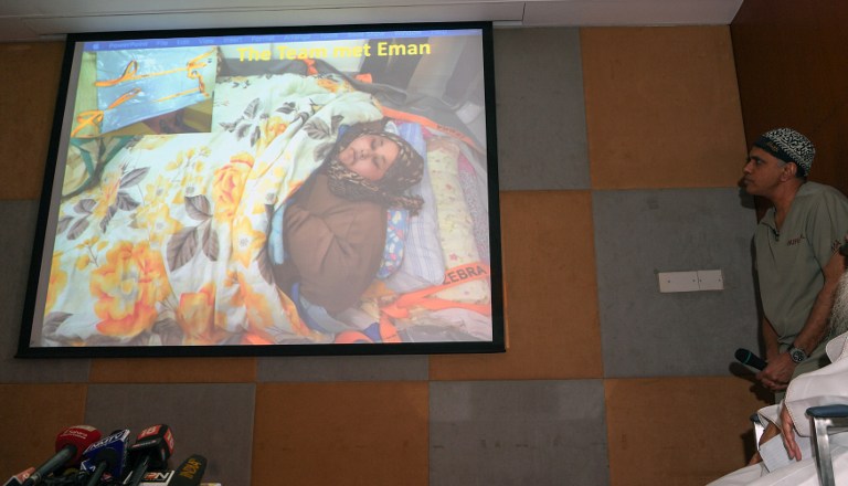 Indian bariatric surgeon Muffazal Lakdawala (R) looks on as images of Egyptian national Eman Ahmed Abd El Aty, who weighs around 500 kilograms (1,100 pounds), are shown at a press conference in Mumbai on February 13, 2017. Abd El Aty, 36, believed to be the world's heaviest woman, weighing around 500 kilograms (1,100 pounds) will undergo weight reduction surgery in India after an intervention from the country's foreign minister ensured her a visa.  AFP