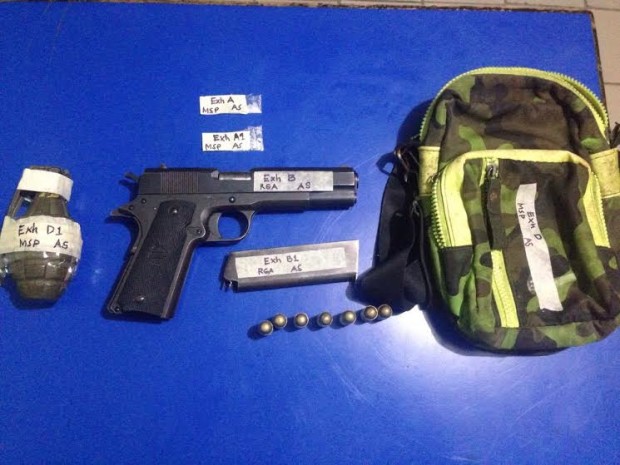 Olongapo City police seized from "fake cop" Wilfredo Soria, on Feb. 1, 2017, a .45-Armscor loaded with seven rounds of live ammunition, a hand grenade, and two plastic sachets containing alleged shabu (methamphetamine hydrochloride). (Photo from the Olongapo City Police Office)