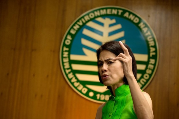 This picture taken on February 22, 2017 shows Philippines' Department of Energy and Natural Resources (DENR) Secretary Regina Lopez gesturing during an interview at the DENR building in Manila. After two decades as a yoga missionary, Philippine Environment Secretary Regina Lopez is unleashing her inner rage on the mining industry while aiming for Bhutan-style gross national happiness. / AFP PHOTO / Noel CELIS / TO GO WITH Philippines-environment-mining-Lopez, INTERVIEW by Karl MALAKUNAS