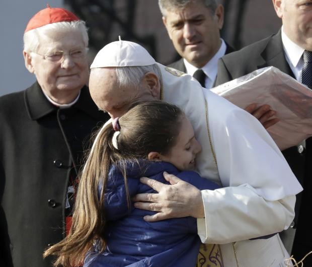 Pope Francis hugs girl in Milan - 25 March 2017