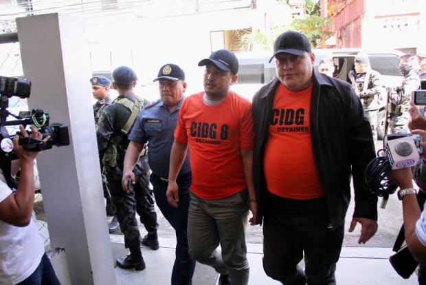 Supt. Marvin Marcos and Chief Insp. Leo Larraga appear at the Regional Trial Court in Baybay City on March 21, 2017,  after they surrendered to their unit, the Criminal Investigation and Detection Group-Region 8.  The two are among the 19 policemen charged with murdering drug suspects, Mayor Rolando Espinosa Sr.,  of Albuera town in Leyte, and Raul Yap on Nov. 5, 2016.  (PHOTO BY INQUIRER VISAYAS)
