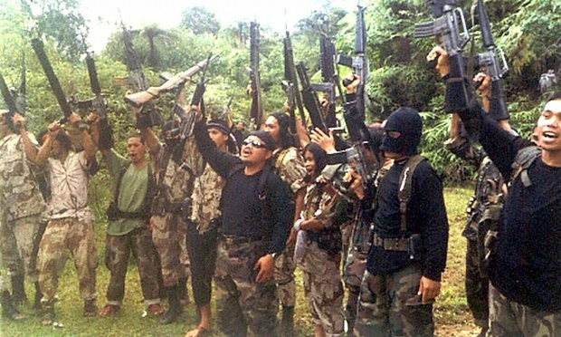 Members of the extremist Abu Sayyaf believed to be behind the 2000 Sipadan hostage crisis. (AP FILE PHOTO / REY BAYOGING)