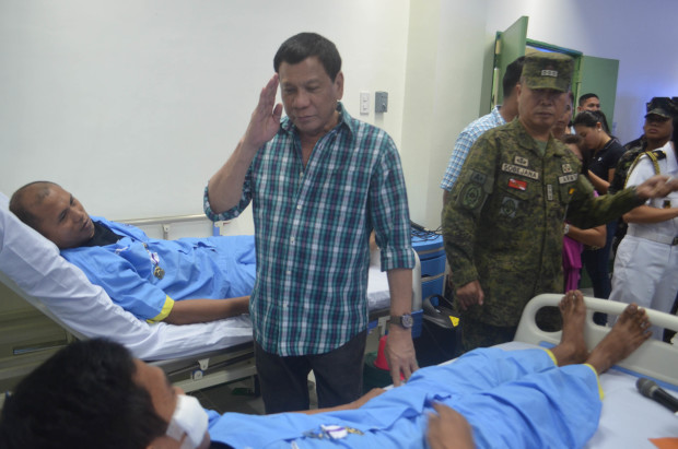 President Rodrigo Roa Duterte greets one of the wounded soldiers during his visit to the Teodulfo Bautista Station Hospital camp in Sulu on March 3, 2017. Almost 30 soldiers were injured this week in separate confrontations with the Abu Sayyaf Group in Sulu. Presidential photo