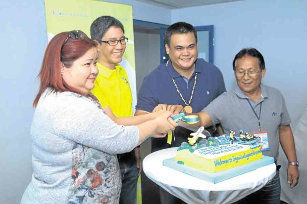 Tourism Undersecretary Katherine de Castro (leftmost) celebrated on March 15 the launch of additional Cebu Pacific flights with (left to right) Alexander Lao, president and CEO of Cebgo; Misamis Oriental Gov. Yevgeny Emano and Eddie Alejandro of the Civil Aviation Authority of the Philippines. —CONTRIBUTED PHOTO