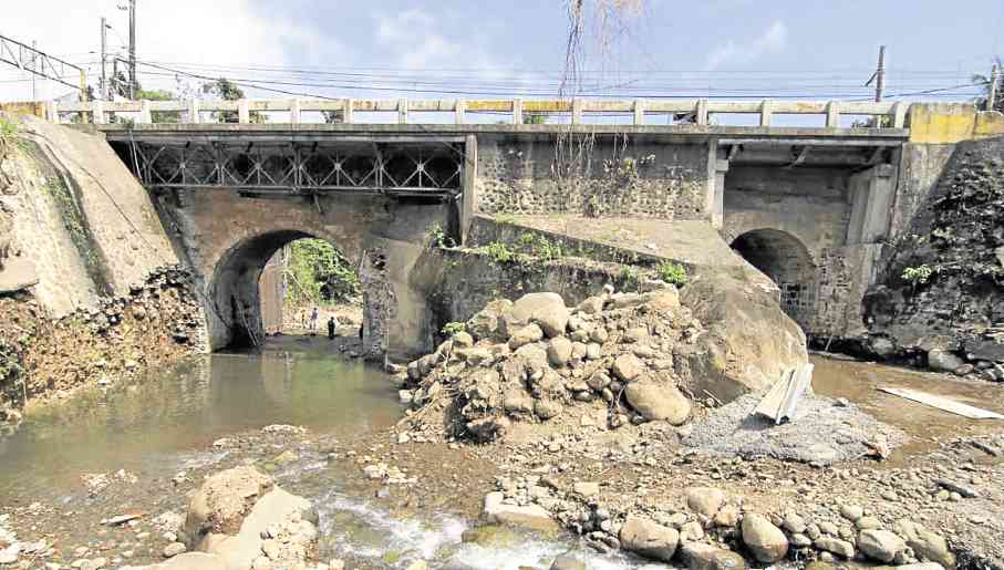 Construction work threatens to damage Gibanga bridge, one of 12 Spanish-era structures in Tayabas City. —DELFIN T. MALLARI JR. 