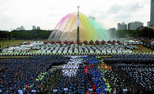 SENDOFF RITES Awater cannon salute is executed before the logo of the Association of Southeast Asian Nations (Asean) 2017 in a sendoff ceremony at Rizal Park’sQuirino Grandstand in Manila for security and emergency personnel whowill be fielded during the Asean summit from April 26 to 29. —MARIANNE BERMUDEZ