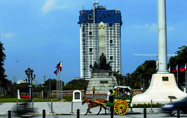  Rizal monument with Torre De Manila at the background. EDWIN BACASMAS