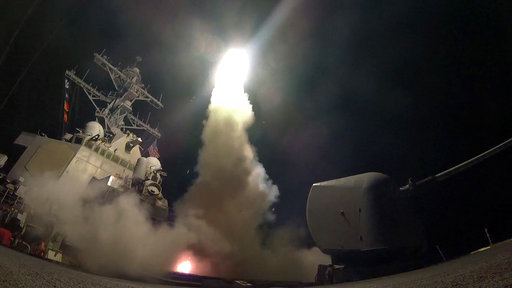 In this image provided by the US Navy, the guided-missile destroyer USS Porter (DDG 78) launches a tomahawk land attack missile in the Mediterranean Sea, Friday, April 7, 2017.  President Donald Trump’s decision to launch missiles at Syria government risked rising tensions with Iran, a key backer of Syrian President Bashar Assad in a conflict with dangerously blurry battle lines. (Mass Communication Specialist 3rd Class Ford Williams / US Navy via AP)