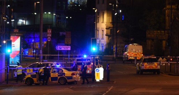 Police deploy at scene of a reported explosion during a concert in Manchester, England, on May 23,  2017. British police said early May 23 there were "a number of confirmed fatalities" after reports of at least one explosion during a pop concert by US singer Ariana Grande. Ambulances were seen rushing to the Manchester Arena venue and police added in a statement that people should avoid the area.  / AFP PHOTO / PAUL ELLIS